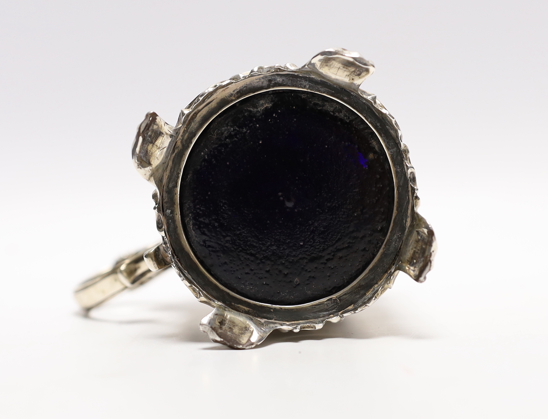 A Victorian embossed silver drum mustard, John Evans II, London, 1863, decorated with foliage and scrolls.